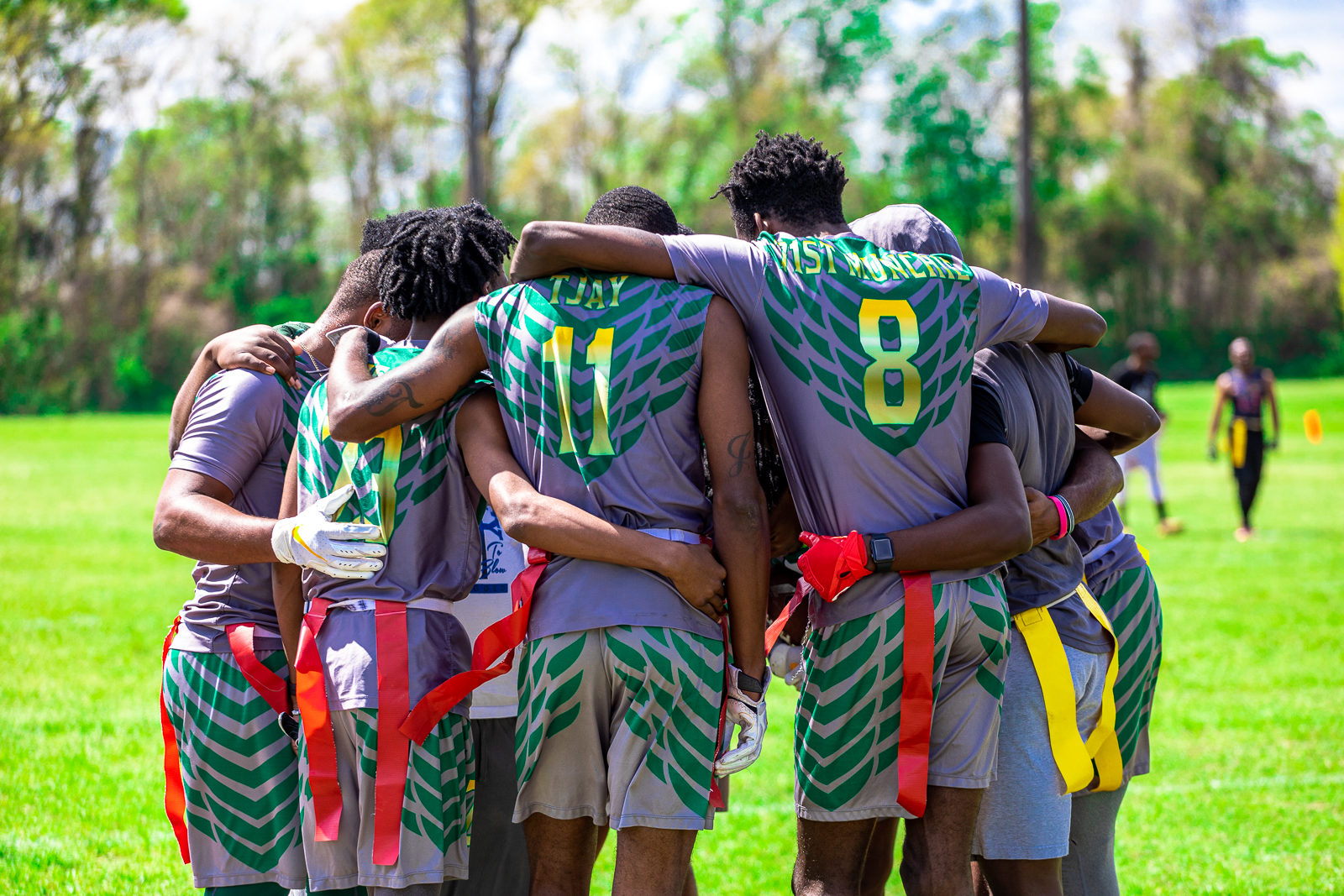 class of adults holding up workout balls during workout class