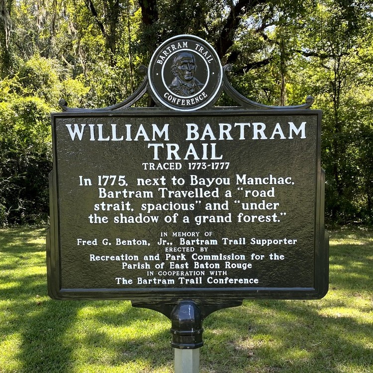 A historic marker placed within Airline Highway Park commemorates the travels of naturalist William Bartram through the area.