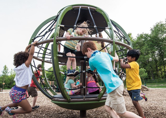 Children playing on spinner.