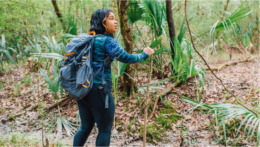 Photo of woman hiking in the woods